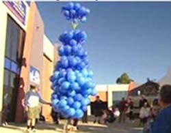 Piglet with hover 200 helium balloons Piglet