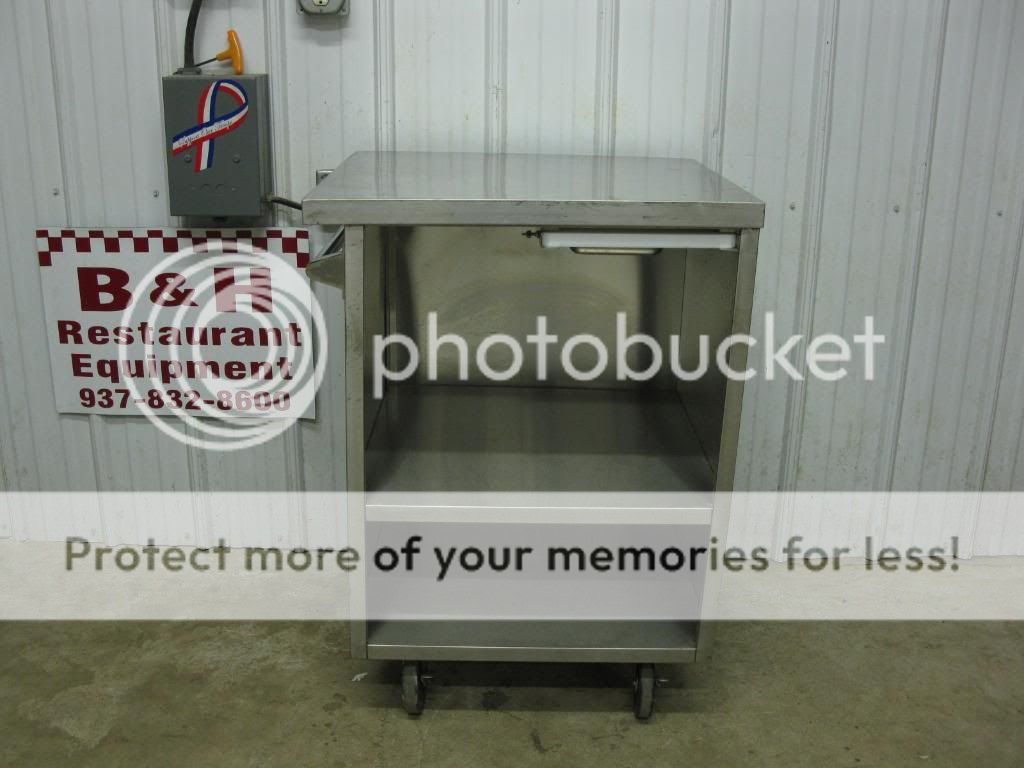 You are looking at a 27 5/8 x 25 1/4 stainless steel mobile table.